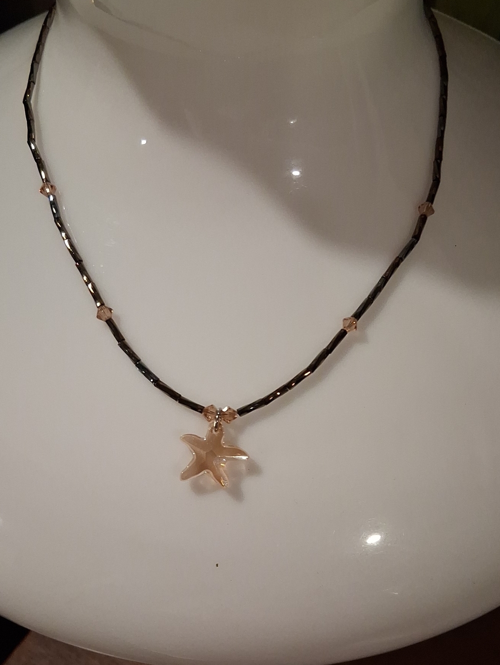 Black Beaded Necklace with Gold Starfish Pendant